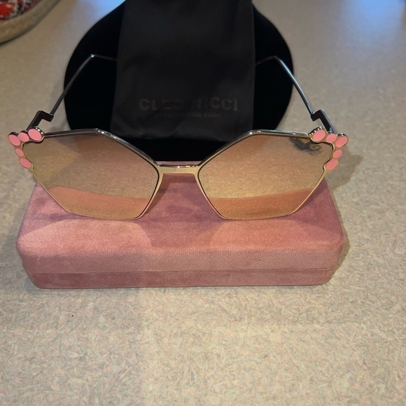 Cleo Nicci sunglasses with pink tint.